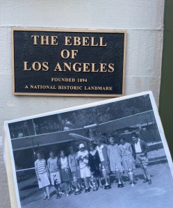 Photo of a photo of some of the pilot from the 1929 Air Derby set against the sign of the Ebell of Los Angeles.